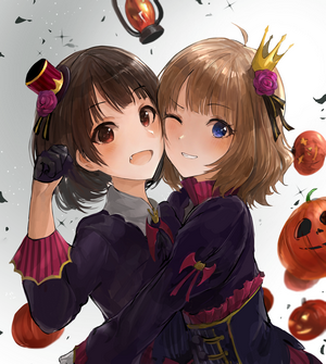 Two anime girls in Halloween costumes with pumpkins