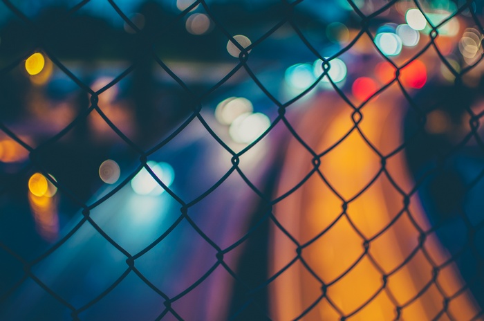 Fence with Bokeh City Lights