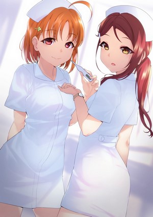 Two nurses with a thermometer