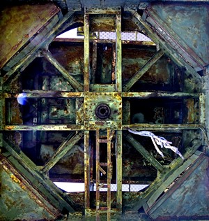 Rusted industrial metal structure with geometric patterns