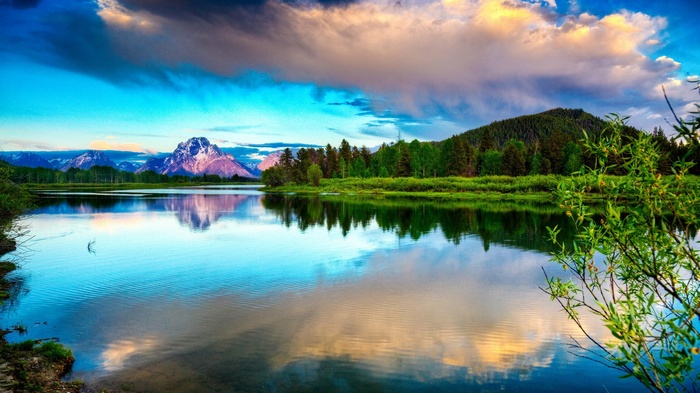 Mountain lake reflection at sunset