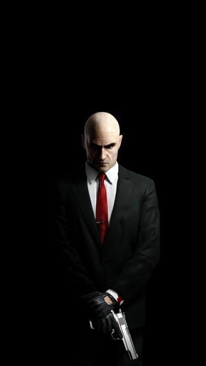 Agent 47 from Hitman holding a gun