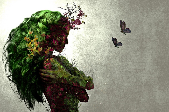Double exposure of a woman made of flowers and leaves with butterflies