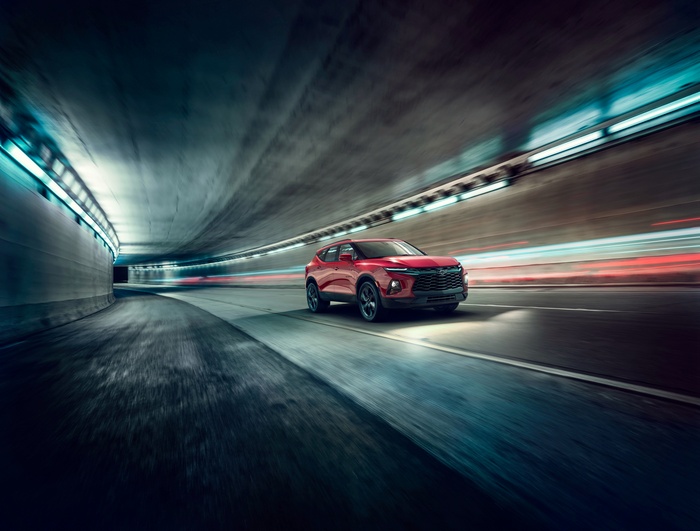 Red Chevrolet Blazer RS driving through a tunnel