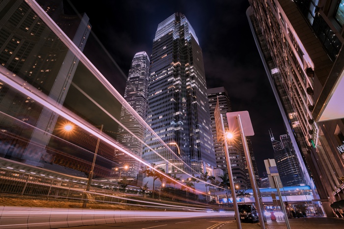 Night traffic in Hong Kong with skyscrapers