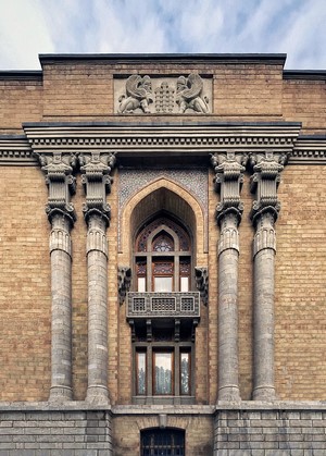 Building facade with columns and arched window in Iran