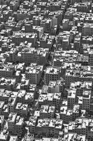 Aerial view of a dense cityscape in monochrome