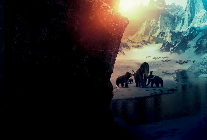 Mammoths in a snowy mountain landscape