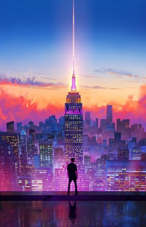 Empire State Building with a light beam at sunset