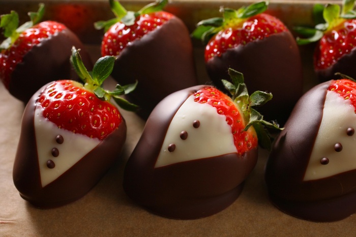 Chocolate-dipped strawberries decorated as tuxedos