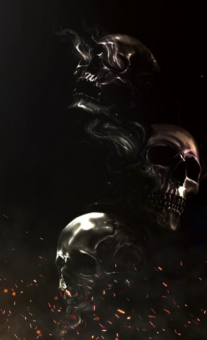 Three skulls emerging from smoke and embers