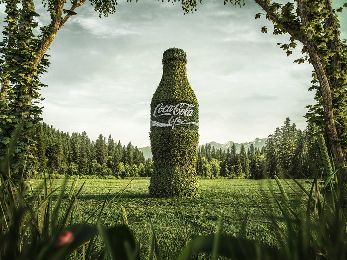 Coca-Cola Life bottle made of leaves in a forest
