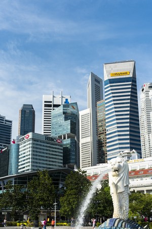 Merlion statue with Singapore skyline and Maybank building