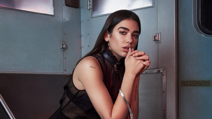 Dua Lipa in a train car