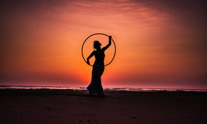 Woman with Hula Hoop at Sunset Silhouette