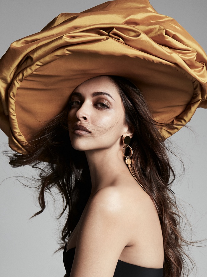 Deepika Padukone wearing a large golden hat