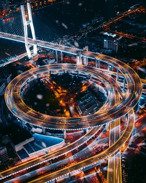 Aerial view of a multi-level highway interchange at night