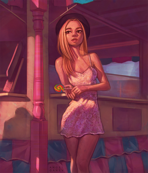 Woman in pink dress holding a lollipop