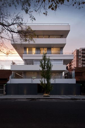 Modern White Multi-Story Building with Balconies