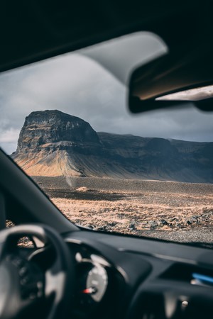 View from car interior of a mountain landscape