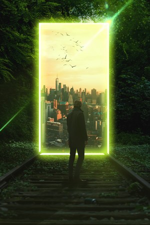Man standing on train tracks looking at a city portal