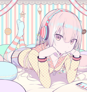 Anime girl with headphones lying in bed