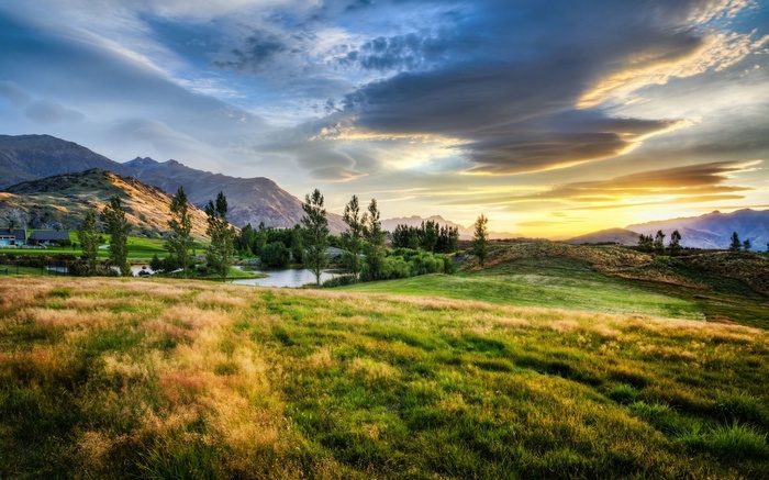 Rolling Hills and Mountains at Sunset