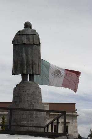 Statue of Benito Juarez with Mexican flag in Pachuca de Soto