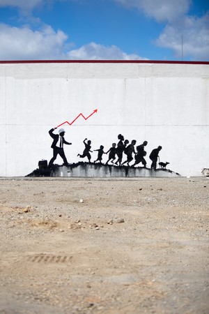Graffiti of a businessman leading people with a red graph