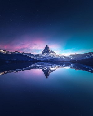 Matterhorn mountain reflected in a lake at dawn