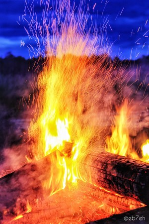 Bonfire with sparks at night