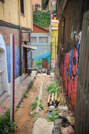 Graffiti-covered alleyway with colorful buildings