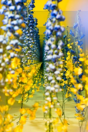 Infinity display of blue and yellow flowers