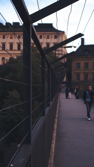 People walking on a bridge in Stockholm, Sweden