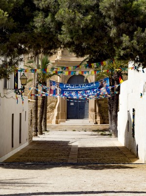 Tabarca Fiestas Patronales banner hanging in street