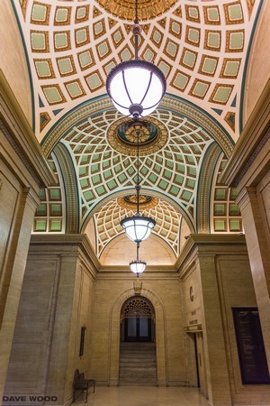 Ornate ceiling with pendant lights in a building