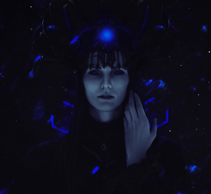 Woman with blue eyes and elaborate headdress