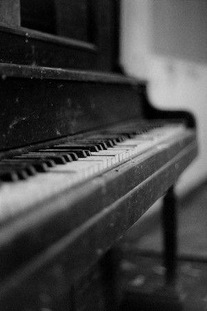 Close-up of an old, dusty piano keyboard