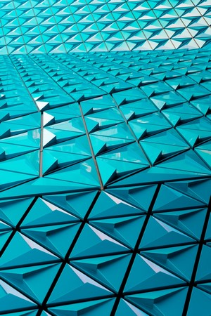 Cyan triangular architectural facade