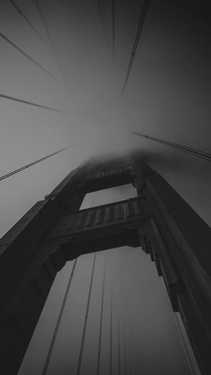 Golden Gate Bridge tower in fog