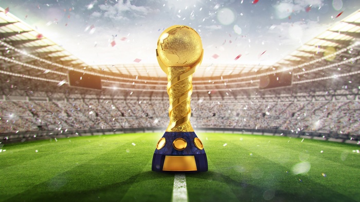 Golden FIFA World Cup trophy in stadium