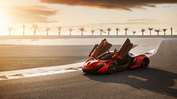 McLaren P1 on a race track at sunset