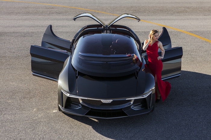 GFG Sibylla Electric Sedan with Woman in Red Dress