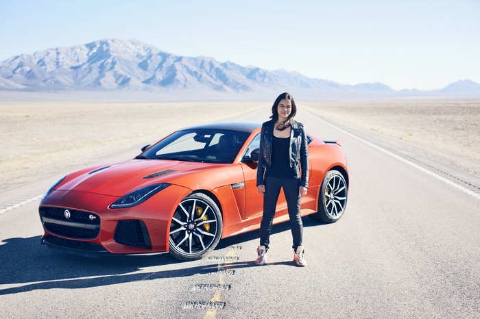 Michelle Rodriguez with Jaguar F-Type SVR in desert