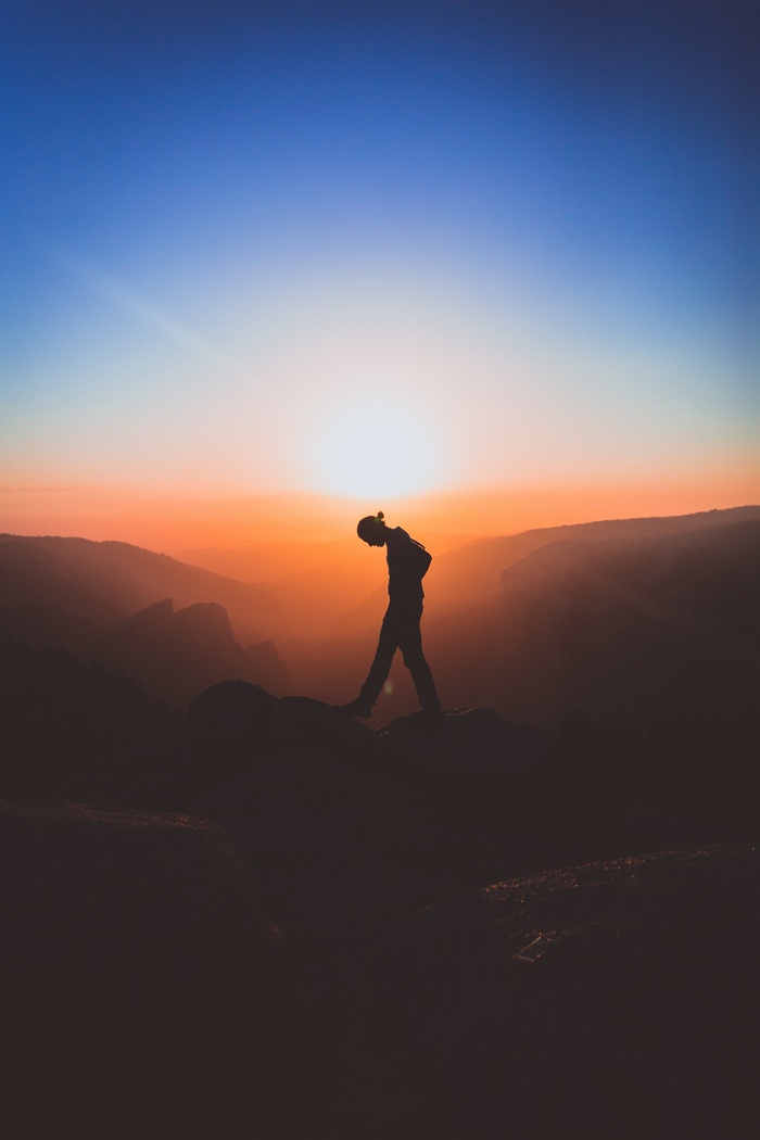 Silhouette of a man walking at sunset in Yosemite Valley