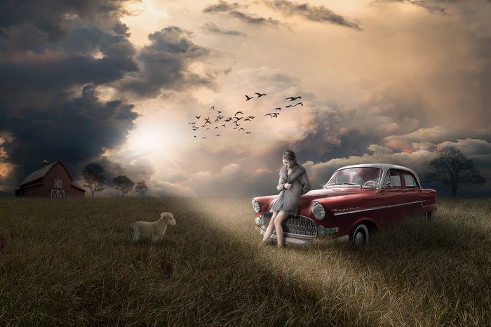 Woman with vintage car and lamb at sunset