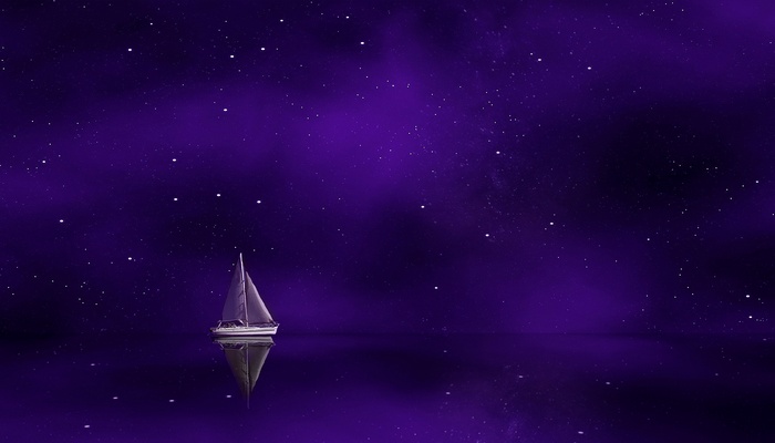 Sailing ship on a purple starry ocean