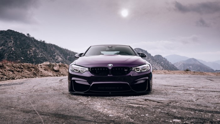 Purple BMW M4 on a Mountain Road