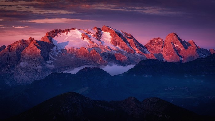 Mountains at sunrise with pink and purple sky
