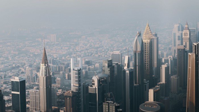 Aerial view of a dense city skyline with skyscrapers